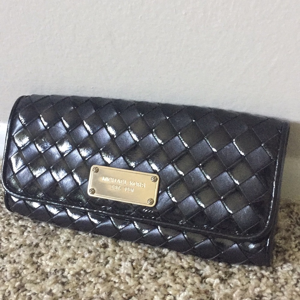 Twice used Michael Koors leather clutch